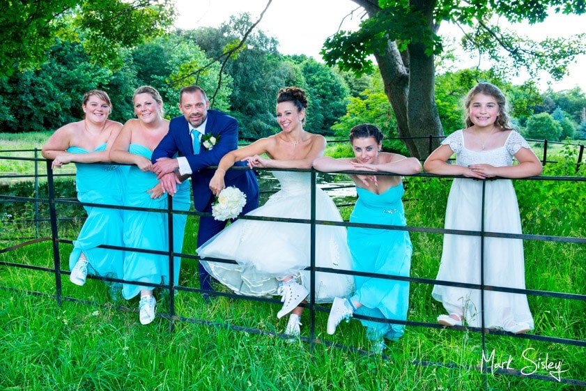 bridal party with turquoise gowns - Mark Sisley Photography