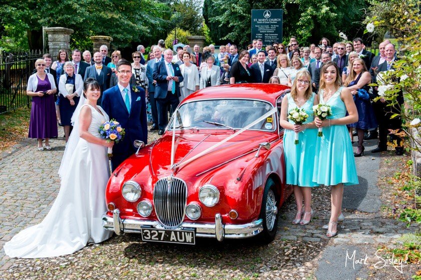 Bridal party and vintage car - Mark Sisley Photography