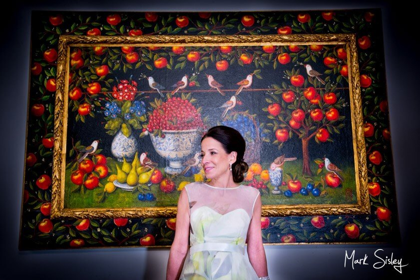 Bride in front of embroidered panel - Mark Sisley Photography