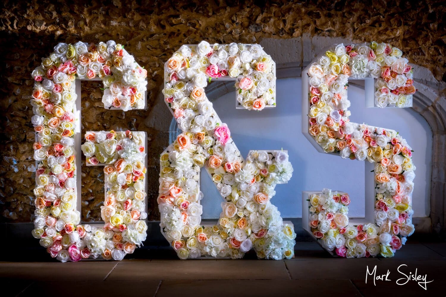 Missenden Abbey giant floral letters on a summer's wedding day 