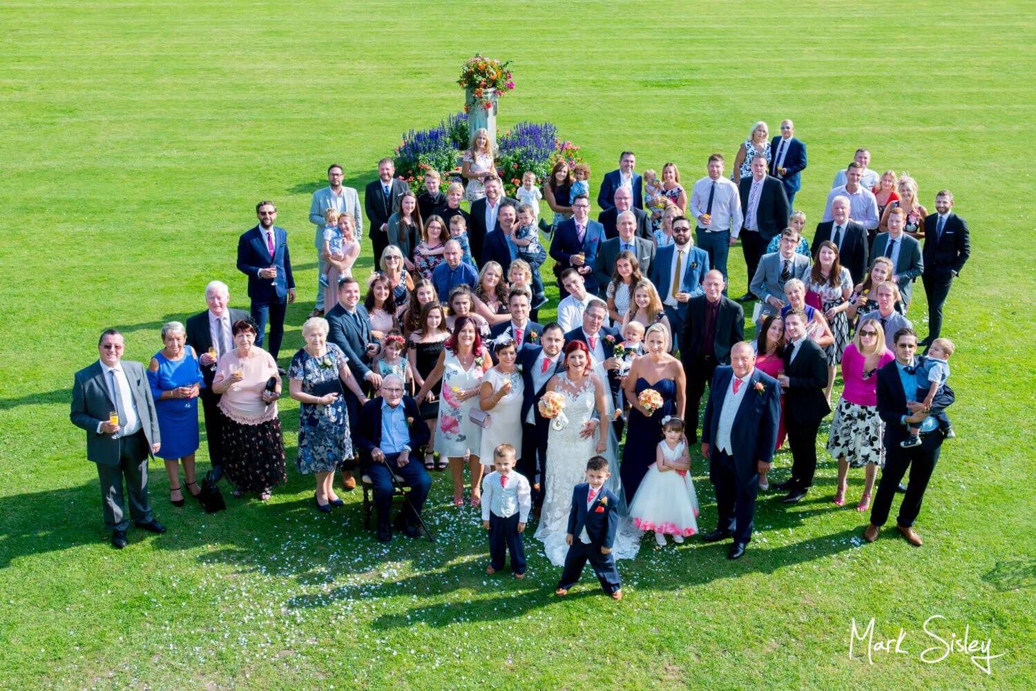 Large group pose at this Missenden Abbey wedding celebration