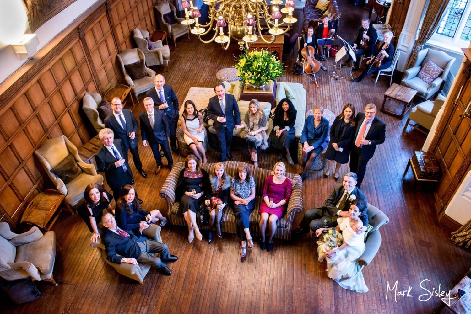 Danesfield House wedding photography of the wedding guests in the Great Hall