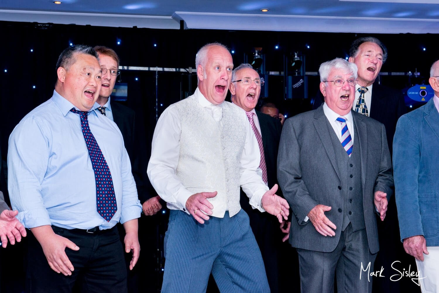 Oakley Court wedding photography of the guys singing their hearts out