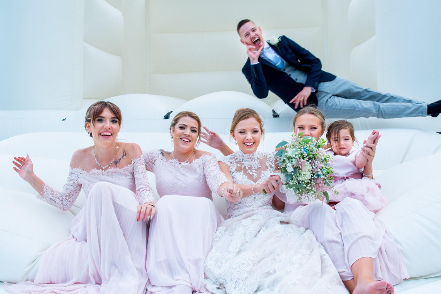 Missenden Abbey wedding antics on the bouncy castle