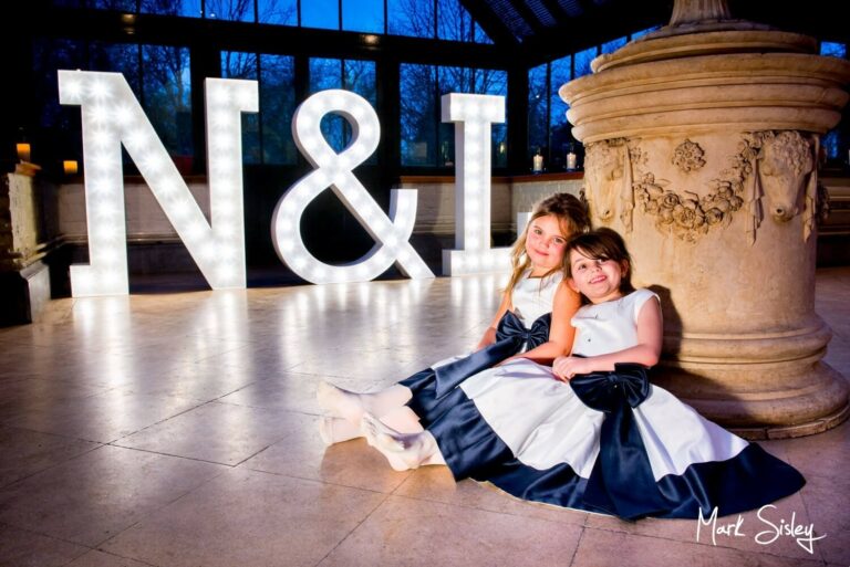 The flower girls strike a pose at Dairy Waddesdon Spring wedding