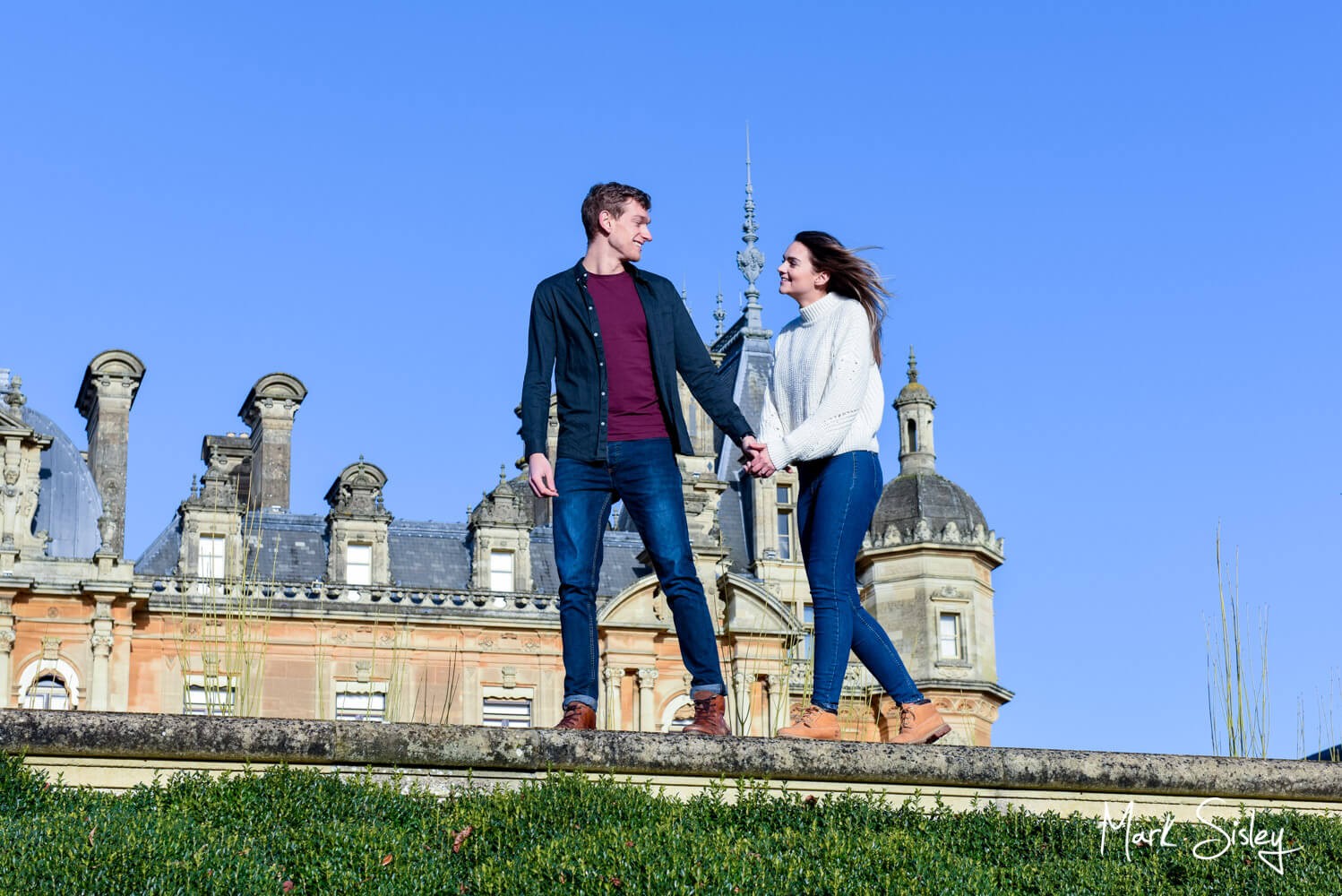 Waddesdon Manor portrait photograph of a couple walking along a wall
