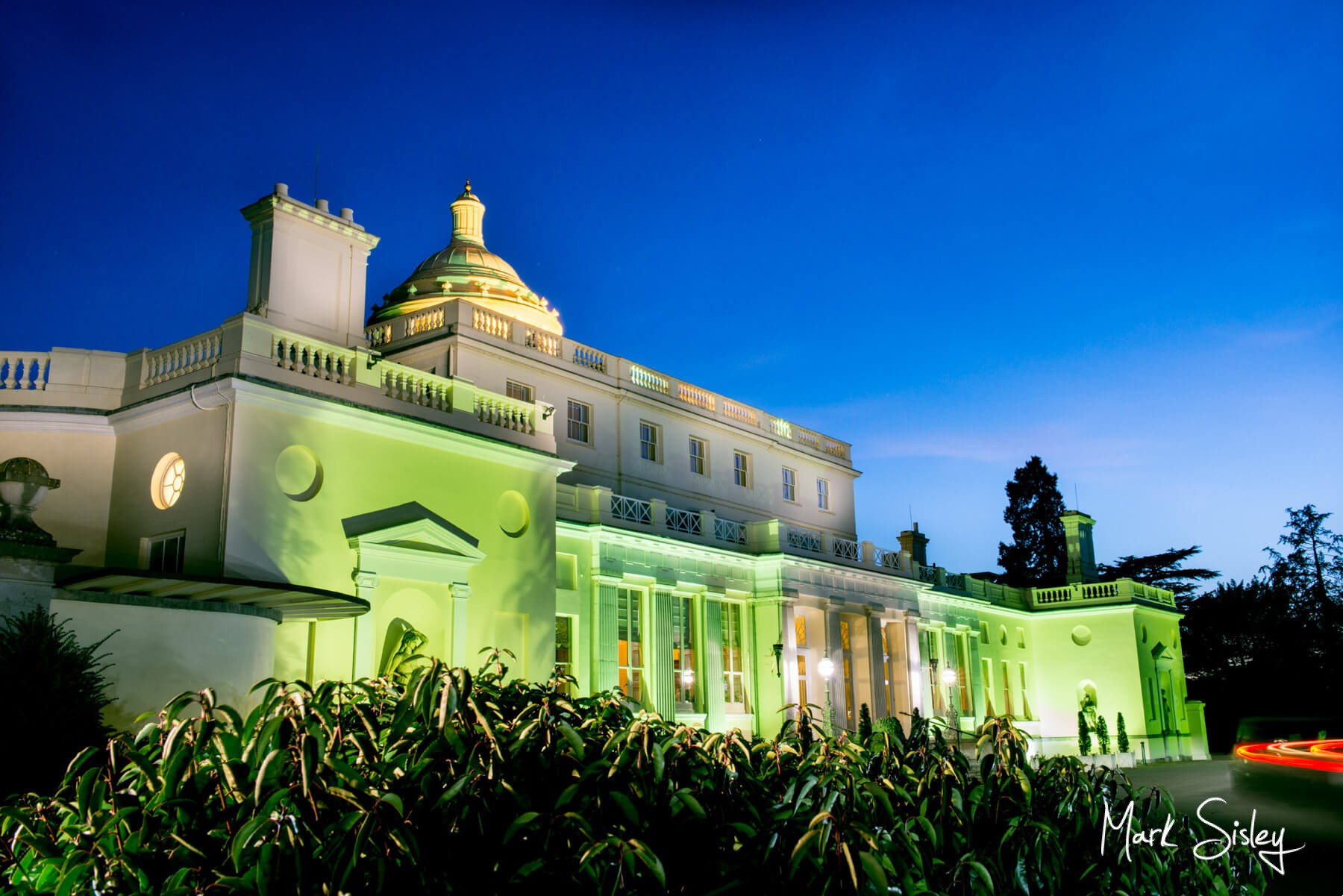 Buckinghamshire Wedding Photography - Stoke Park Hotel - twilight image with green uplighting