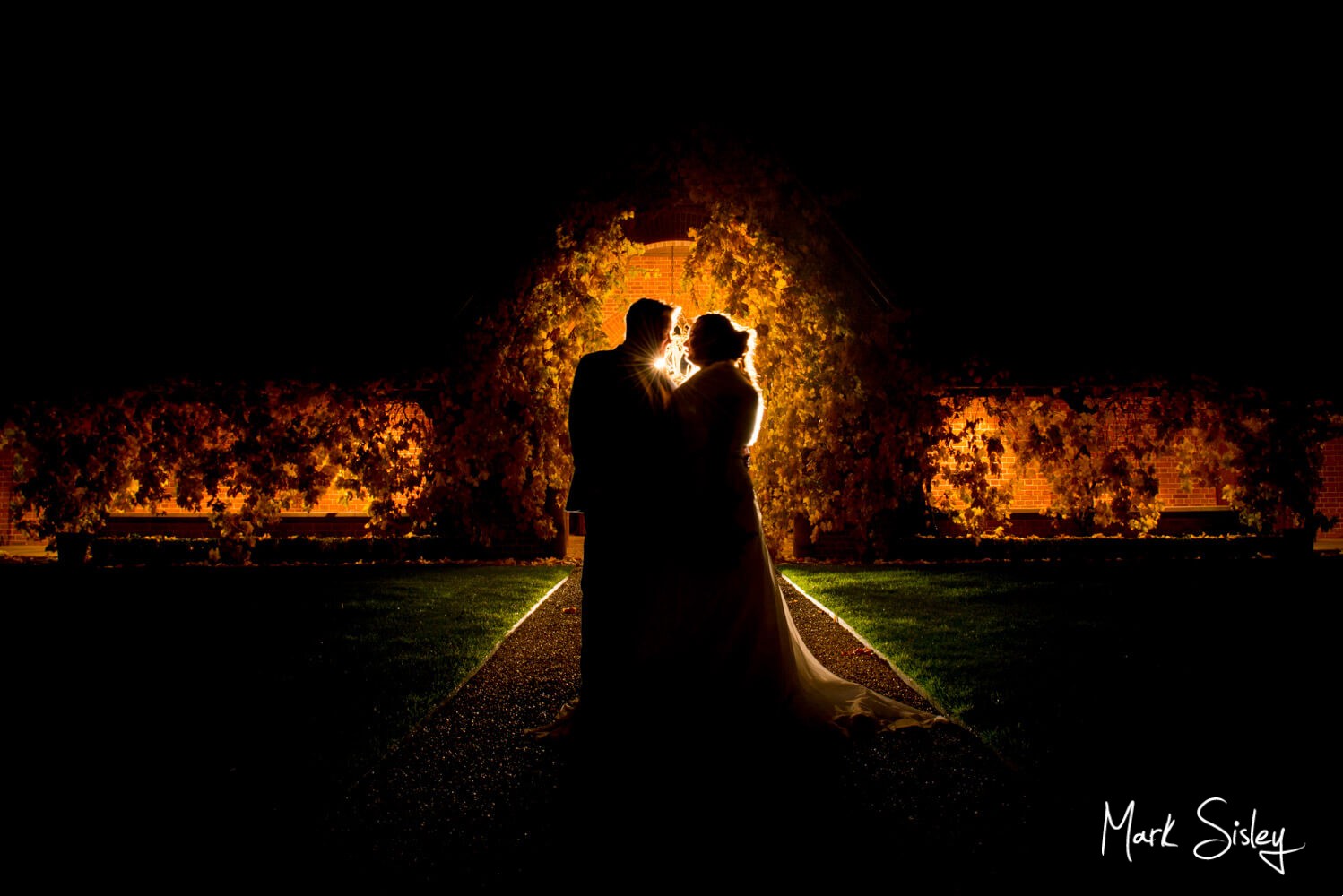Bride & groom in silhouette at Waddesdon Dairy winter wedding 