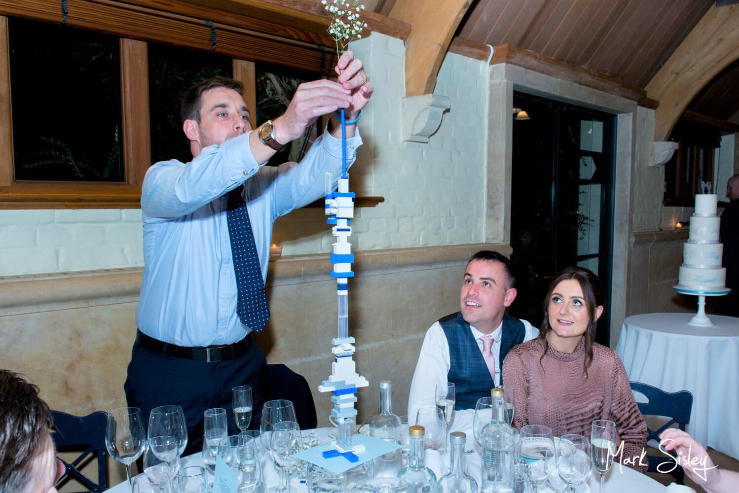 Building a Lego tower at Waddesdon Dairy winter wedding