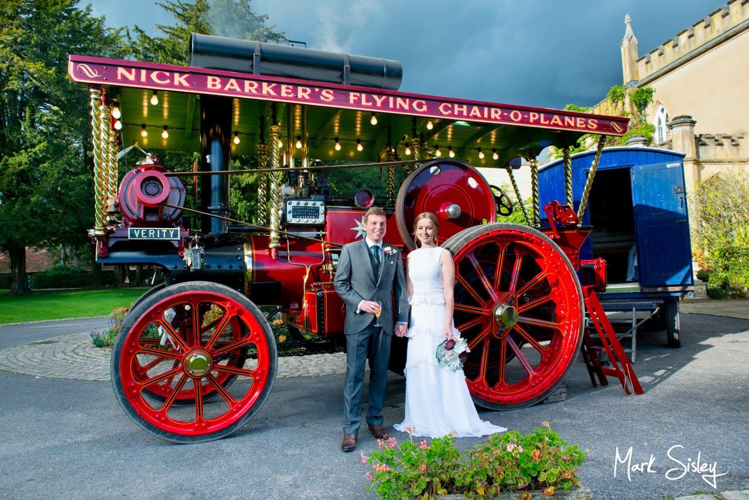 Missenden Abbey wedding pictures - bride & groom with Verity the steam engine
