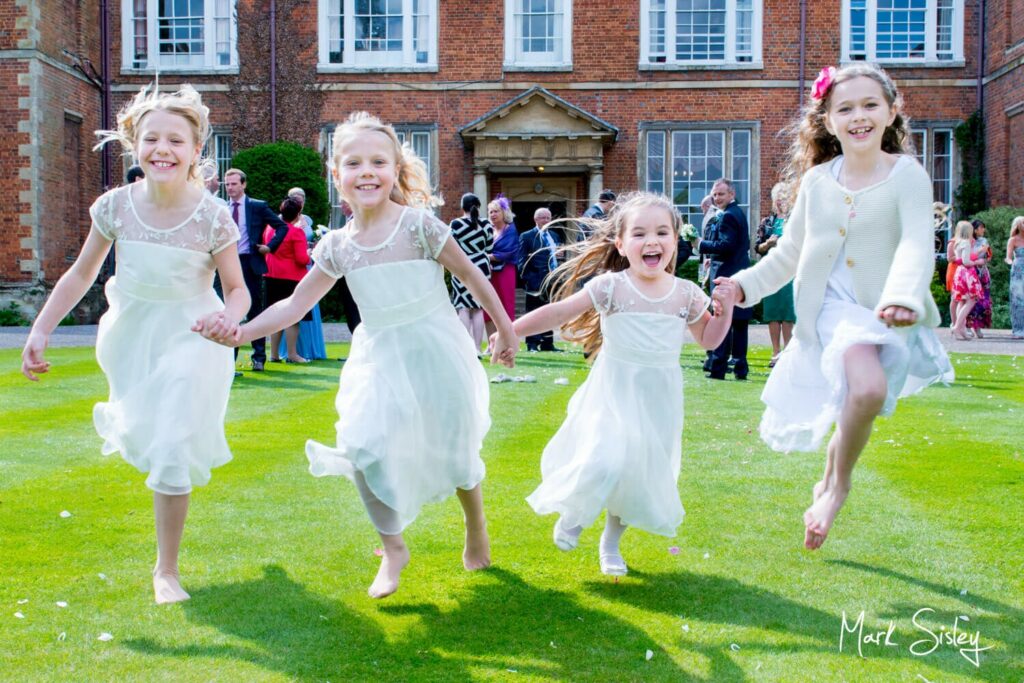 Photos at Dorton House wedding of the young girls running