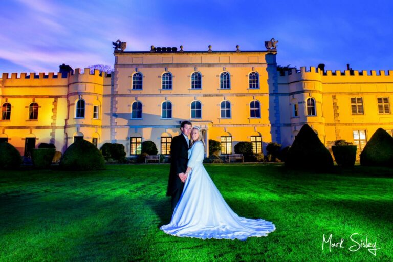 Floodlit Hampden House Christmas wedding pose