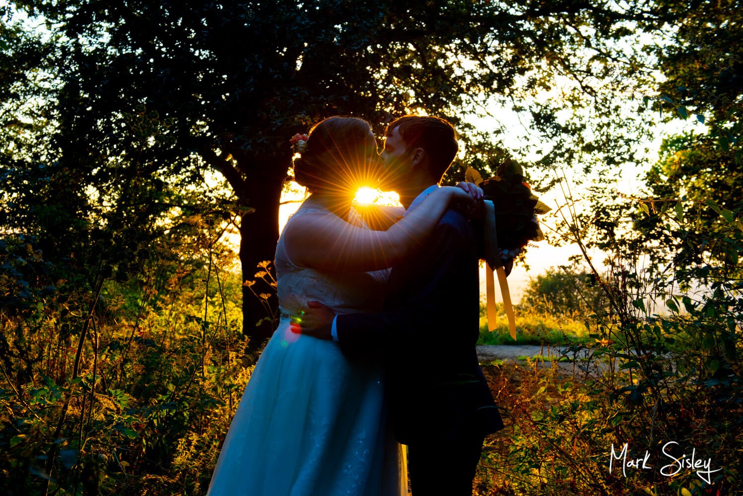 Silhouette sunset photography of the bride and groom - Lambert Hotel wedding near Thame 