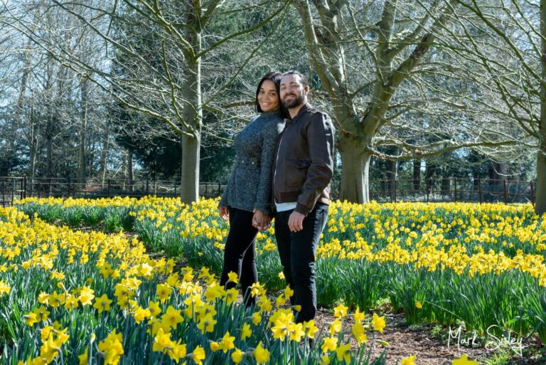 Hartwell House engagement portrait captured of the couple in the hotel's daffodil meadow