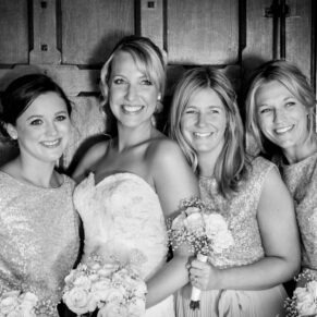 Black and white wedding photography in Buckinghamshire -  portrait of bride and bridesmaids at The Dairy Waddesdon