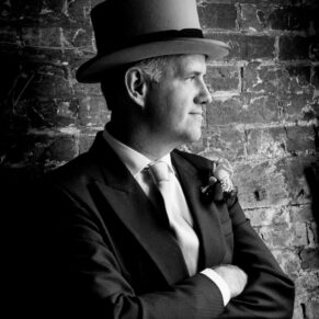 Black and white wedding photography in Buckinghamshire - portrait of usher at Chalfont St Giles parish church