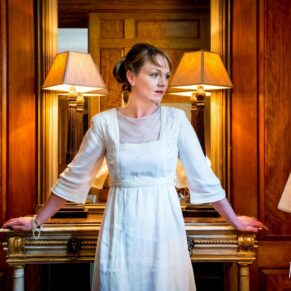 The bride posed up in front of an antique mirror at her Covent Garden Hotel wedding in central London