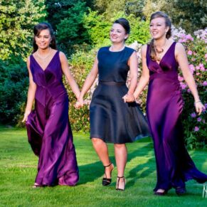 Bridesmaids walking on the lawn at Taplow House Hotel wedding