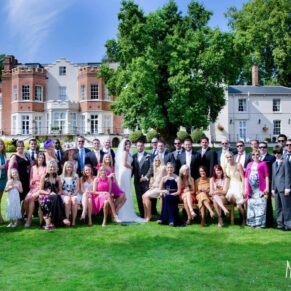 Photography of wedding guests on lawn at Taplow House Hotel wedding