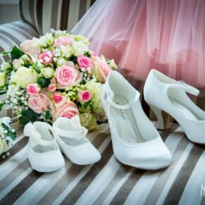 Close-up image of wedding shoes and bouquet at Taplow House Hotel wedding