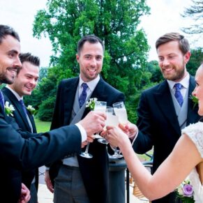 Fun informal image of wedding guests at Taplow House Hotel wedding