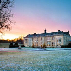 Frost on lawns at sunrise at Hartwell House winter wedding