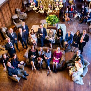 Danesfield House winter wedding photography of all the guests gathered in the Great Hall