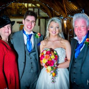 Bride and groom and family at Notley Tythe Barn wedding