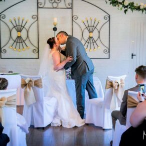 The first kiss at Five Arrows Hotel wedding ceremony