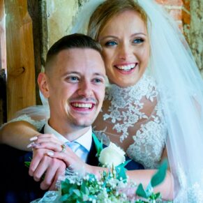 Missenden Abbey wedding of the newlyweds enjoying a hug in the summerhouse