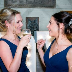 Bridesmaids laughing at Waddesdon Dairy Christmas wedding