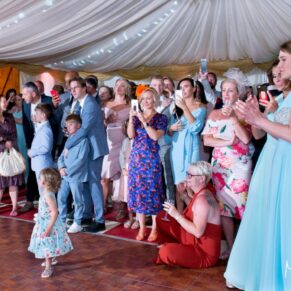 Notley Tythe Barn wedding guests watching the first dance