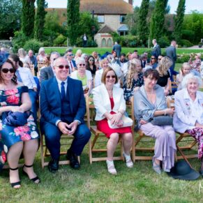 Wedding guests awaiting ceremony at Notley Tythe Barn wedding