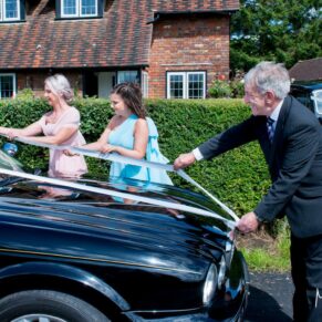 Vintage wedding car at Notley Tythe Barn wedding