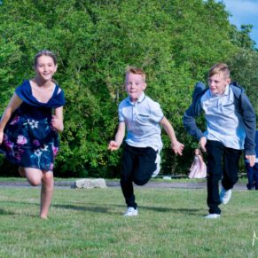Notley Tythe Barn wedding kids dashing through the gardens