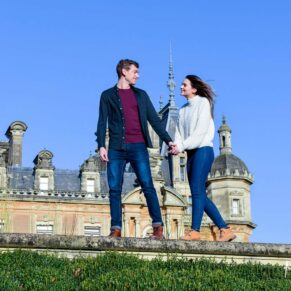 Waddesdon Manor portrait photograph of a couple walking along a wall