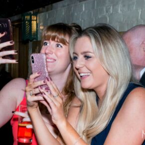Waddesdon Dairy winter wedding photography of some guests enjoying the partying