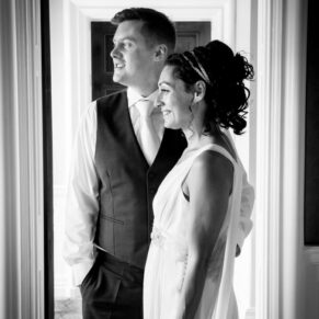 Cliveden House window lit wedding photographs of the newlyweds