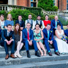 Group pose on the steps at Latimer Estate wedding