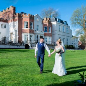 Taplow House wedding photos of the newlyweds walking through the grounds