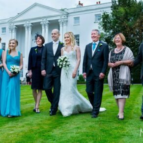 The bride's family taking a stroll at the front of the White House at her Beaumont Estate wedding 