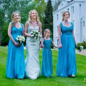 Photography of the ladies taking a stroll at this Beaumont Estate summer wedding whilst giggling at someone away in the distance who is making them laugh