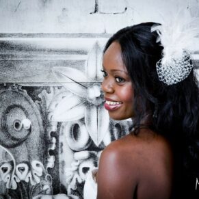 The beautiful bride poses for a close-up portrait with a monochrome backdrop at this Beaumont Estate wedding
