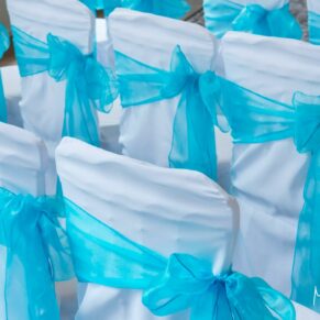 The blue themed chairs in the wedding ceremony room