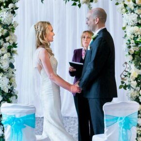 The bride and groom captured looking at one another during their civil wedding ceremony vows at their Beaumont Estate wedding   