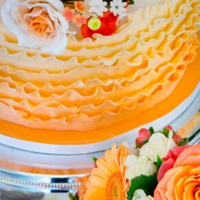 A stunning orange themed cake for the guests to enjoy