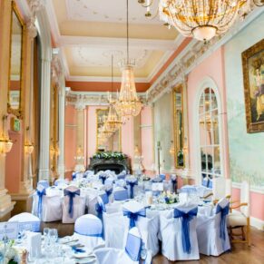 The opulent high ceilinged Versailles Room setup just before the guests were called in for the wedding breakfast at Danesfield House
