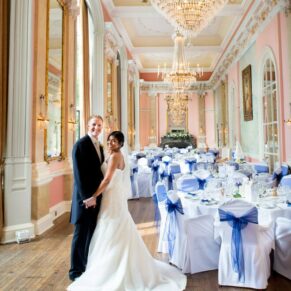 The newlyweds in the Versailles Room at Danesfield House just prior to their guests being invited to join them for the wedding breakfast