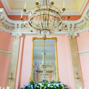 Fabulous high ceilings and chandeliers can be seen here in the Versailles Room