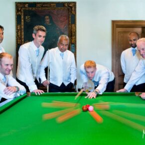 The lads pre wedding ceremony take a shot at the billiards table with a little time exposure thrown in to ensure there's some movement as the balls fly across the table at Danesfield House Hotel